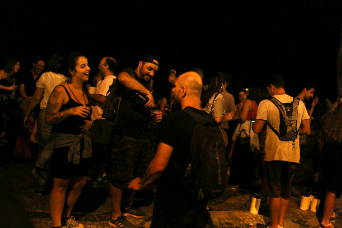 People enjoy beer in front of a bar on the in Rio de Janeiro, Brazil.